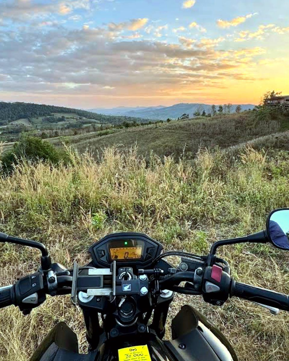 View from a rental Honda over hills at sunset